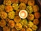 Tealight Candle Diya With Marigold Flower Floating in Water Inside Large Bowl. Happy Diwali - Hindu festival of lights