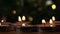 Tealight candles flickering with bokeh background