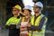 A team of architects, civil engineers, engineers, diversity standing with crossed arms confidently at the expressway construction