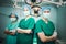 A team of Asian doctors, male and female surgeons Standing in the operating room