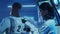 Team of astronauts in a space suits aboard the orbital station. A crew of cosmonauts preparing the spacesuit. Man and