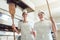 Team of baker women standing in bakery giving thumbs up