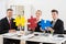 Team Of Businesspeople Holding Jigsaw Puzzle