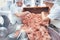 Team of butchers taking minded meat out of grinder