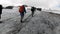 A team of climbers ascending an icy slope on Mt. Everest across the sky above. Clip. People enjoying climbing a snowy