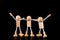 Team concept, Wooden Stick Figures team isolated on black background.