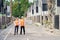 Team of construction specialists posing for camera on building site