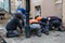 Team Of Construction Workers Building Pavement With Cobblestones