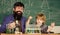 team of creators. bearded man teacher with little boy. father and son at school. Chemistry and physics biology. Back to