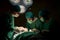 Team doctors in operating room dressed green uniforms saving lives critically patient undergoing heart surgery for heart patients