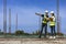 Team of engineering architect inspector and contractor having discussion while examining the quality of construction work of real