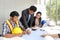 Team engineers working meeting room at the office. Three workers are talking construction plan. Electricians carpenter or Technica