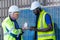 Team factory worker technician engineer men showing and checking model building and solar cell panel for sustainable technology.