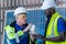 Team factory worker technician engineer men showing and checking model building and solar cell panel for sustainable technology.