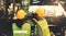 Team of female mechanics working in a lathe inspects the drill stand and put on safety gear.