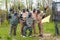 Team of five men with flag play paintball