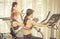 Team of girlfriends working out on fitness machines