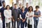 Team of healthcare workers at a hospital smiling to camera