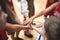 Team of kids children basketball players stacking hands in the court, sports team together holding hands getting ready for the