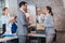 Team leader executive introducing new just hired female employee to colleagues