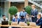 Team of multi national young businessmen sitting on table