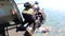A team of parachutists jump out of an airplane, shot in super slow motion.