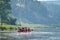 Team of people float down the River on inflatable catamaran, Russia, Bashkortostan, Ay river.