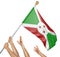 Team of peoples hands raising the Burundi national flag
