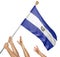 Team of peoples hands raising the El Salvador national flag
