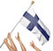 Team of peoples hands raising the Finland national flag