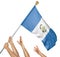 Team of peoples hands raising the Guatemala national flag