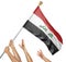 Team of peoples hands raising the Iraq national flag