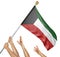 Team of peoples hands raising the Kuwait national flag