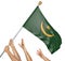 Team of peoples hands raising the Mauritania national flag