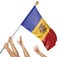 Team of peoples hands raising the Moldova national flag