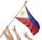 Team of peoples hands raising the Philippines national flag