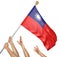 Team of peoples hands raising the Taiwan national flag