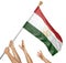 Team of peoples hands raising the Tajikistan national flag