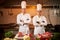 Ð team of professional chefs cook meals in the kitchen of restaurant.  Chief chef preparing dish using different food ingredients