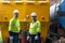 Team railway engineer Inspect repair project train diesel engine in maintenance center. Technician discuss planning checking