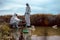 Team of scientists or biologists wears protective clothing to collect water samples from a natural water source with chemical-