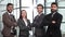 Team successful employees in formal wear posing together in modern office. Teamwork, cooperation, partnership