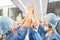 Team surgeons gives themselves high five for motivation