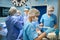 Team of surgeons performs an operation, a patient under anesthesia