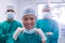 Team of surgeons wearing surgical mask in operation theater