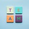 Team text on colorful of notepaper