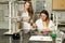 Team of two female laboratory technicians working in chemical or pharmaceutical laboratory