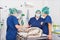 Team of veterinarians in the surgical room preparing a dog for surgery