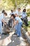 Team Of Volunteers Picking Up Litter In Suburban Street