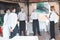 A team of waiters conduct a briefing on the summer terrace of the restaurant